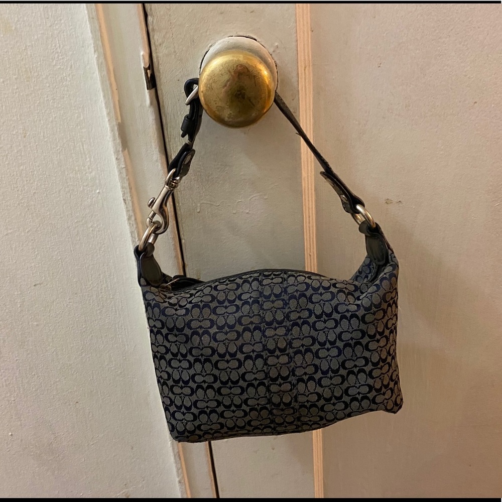 navy blue Coach handbag